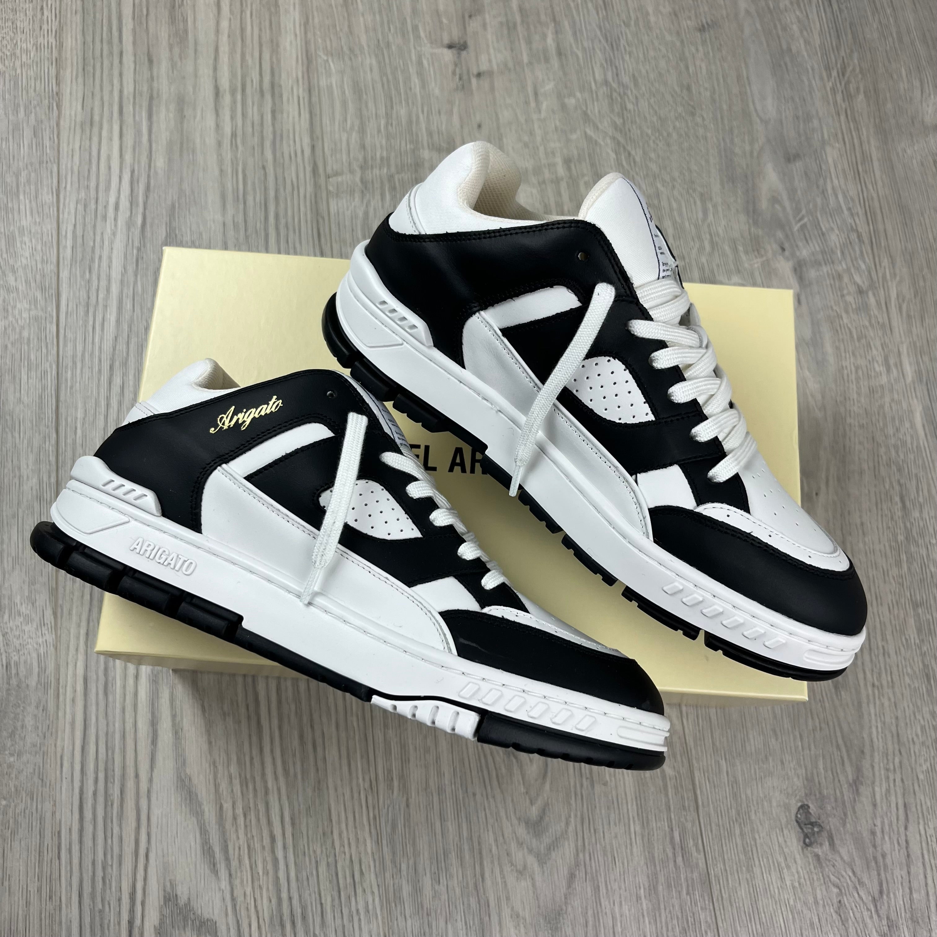 Men's Axel Arigato Arena Lo Sneakers in White/Black. On sale at Open Attire.