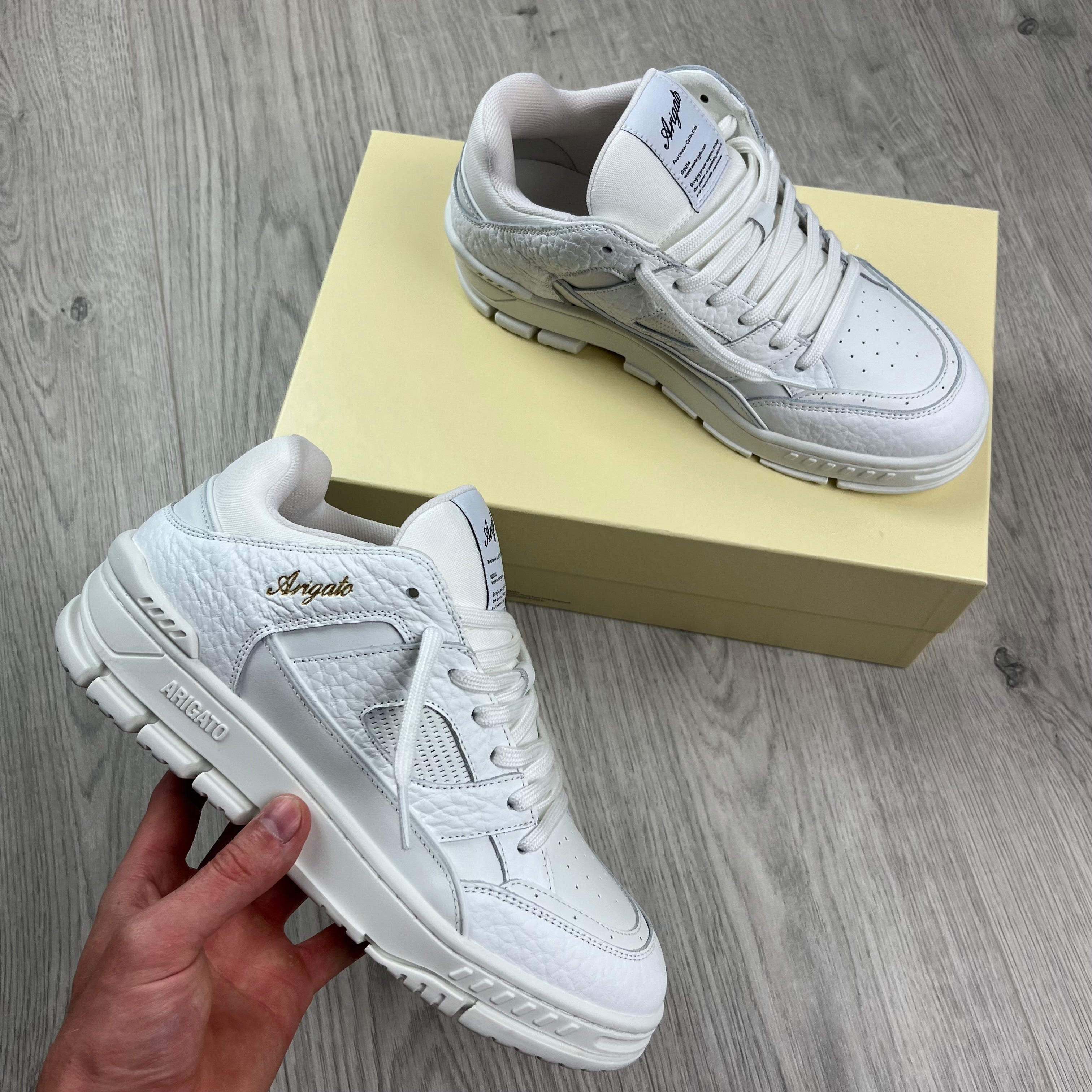 Men's Axel Arigato Arena Lo Sneakers in White. On sale at Open Attire.