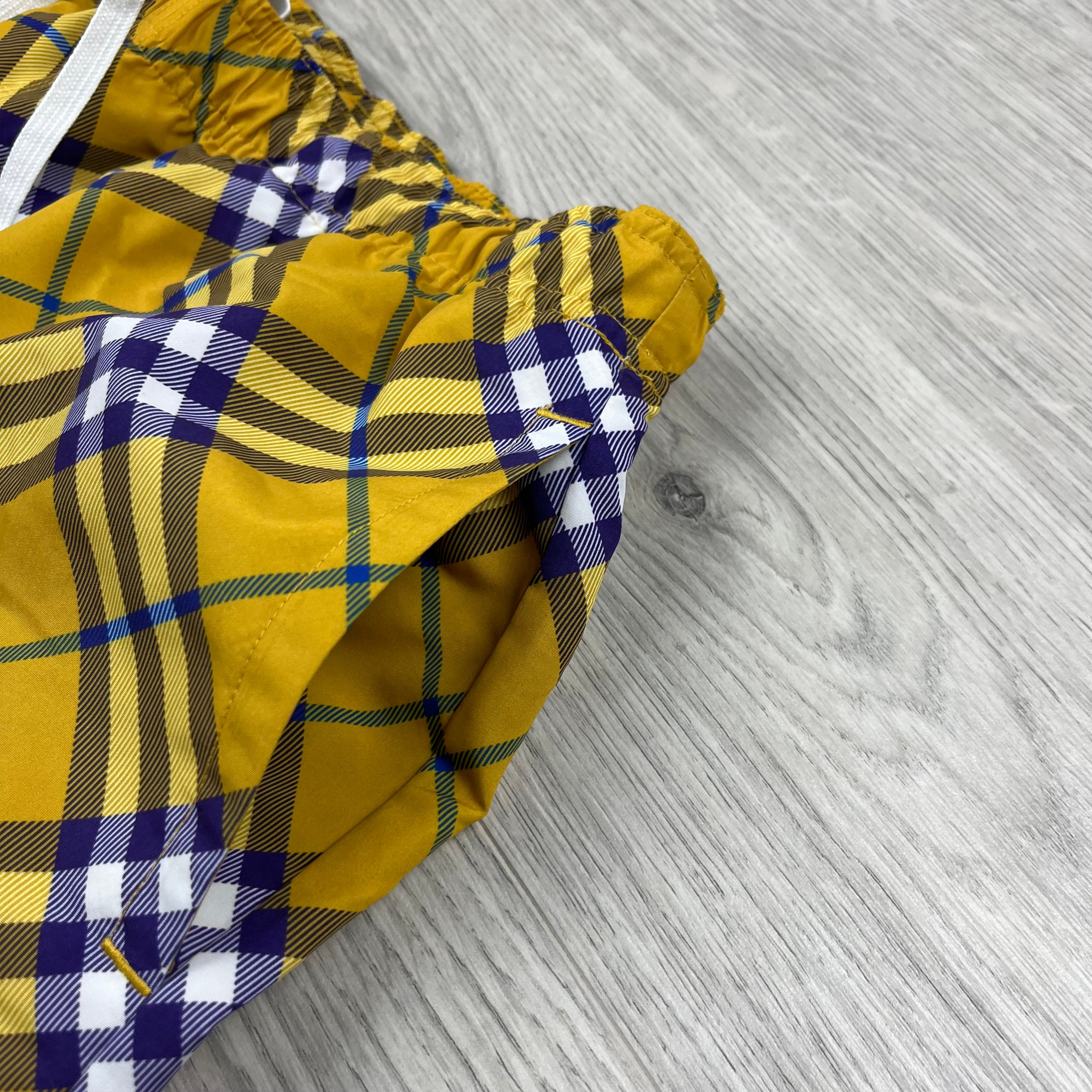 Burberry Vintage Check Swim Shorts in Yellow Pear. On sale at Open Attire.