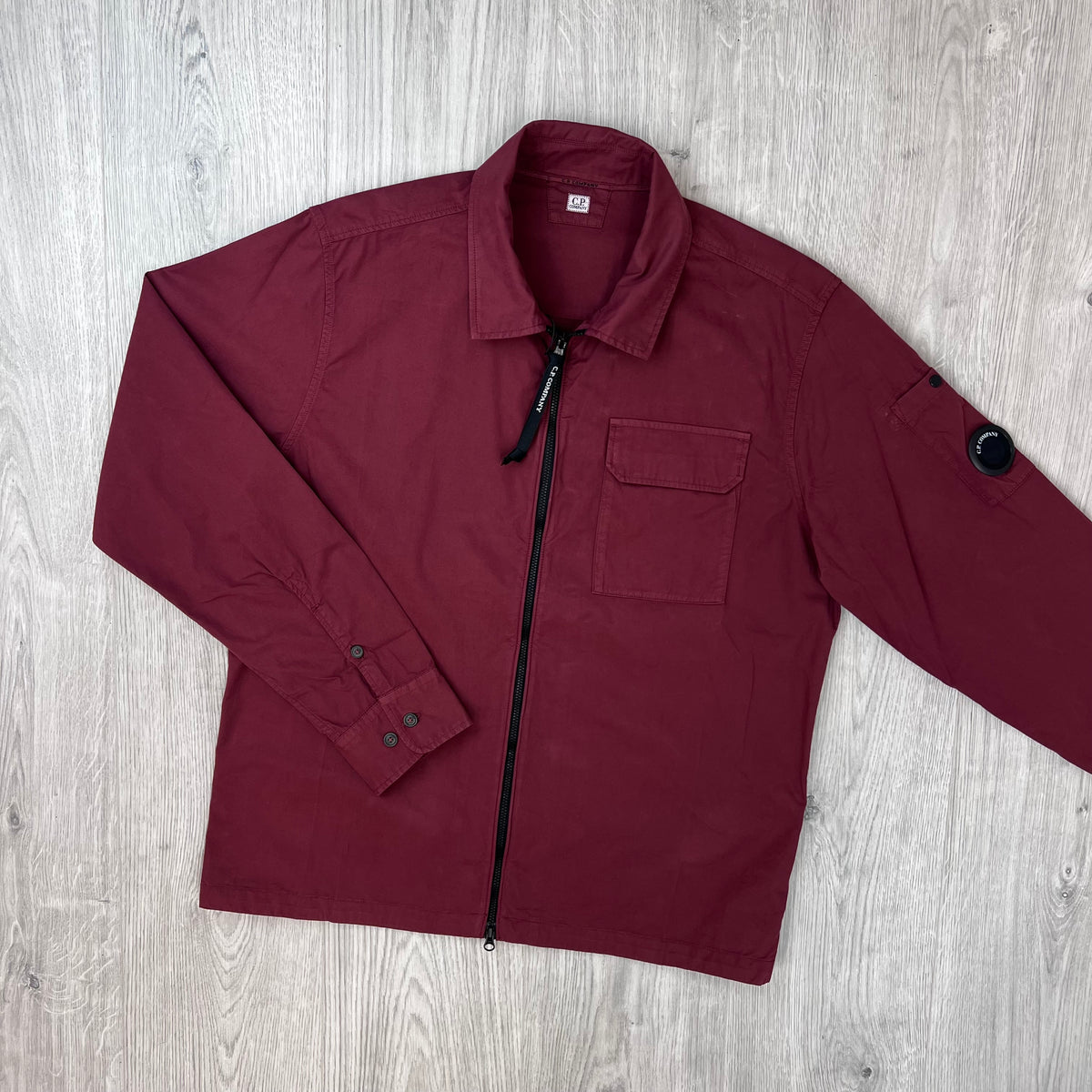 Front view of the CP Company Zip Overshirt in Andorra Red.