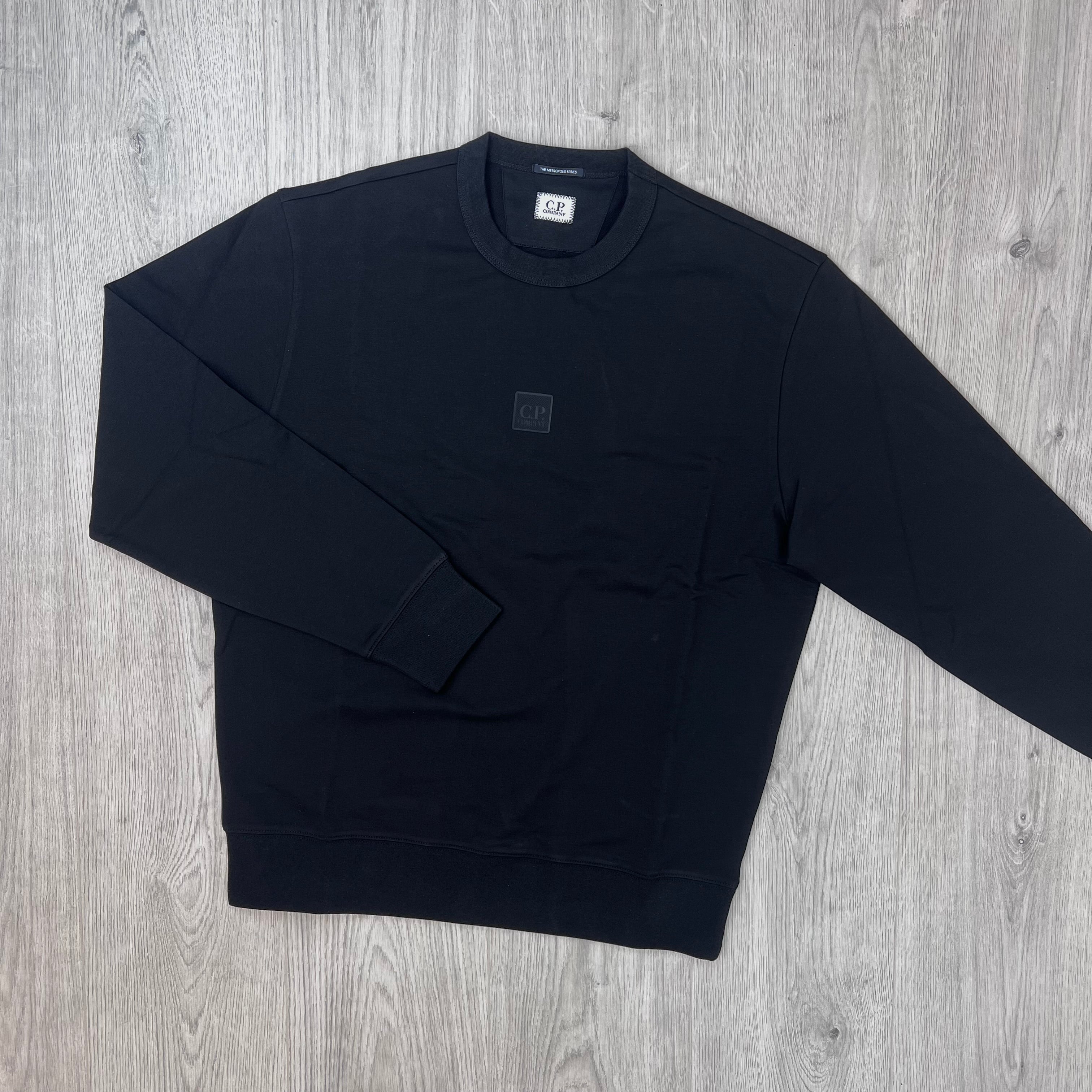 The front view of a CP Company Metropolis Series Stretch Fleece Sweatshirt with one arm outstretched.