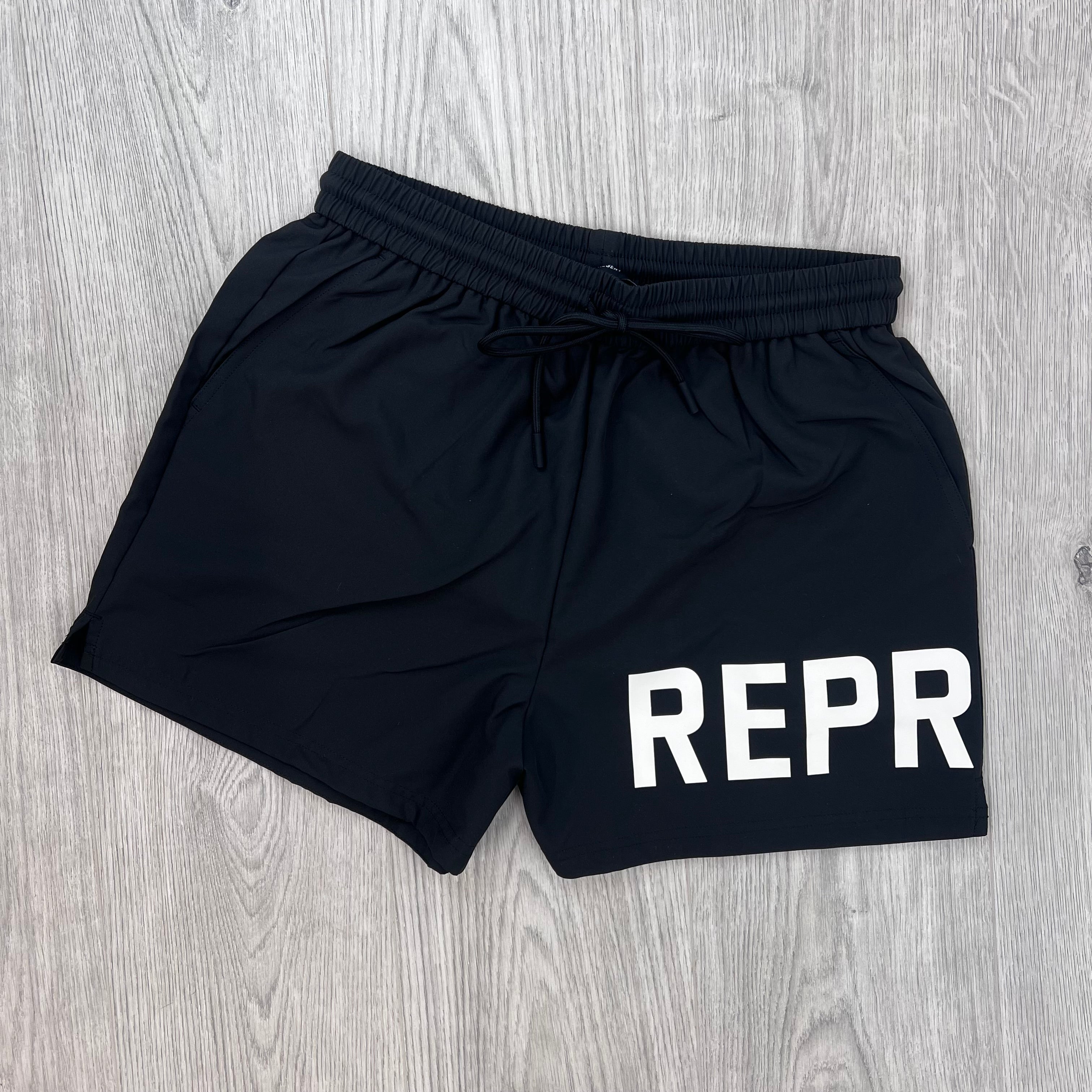 Front view of the Represent Swim Shorts in Black.