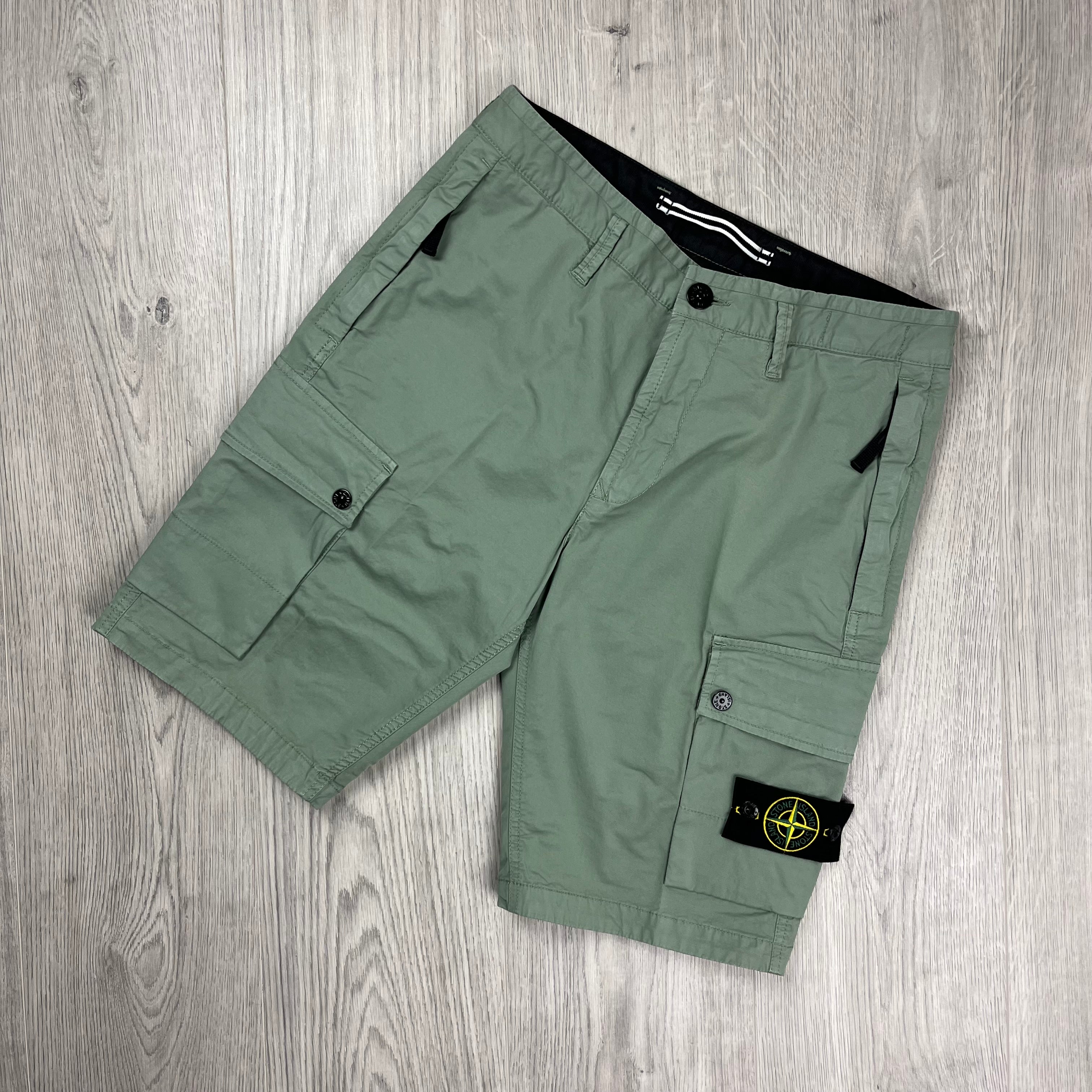 Stone Island Bermuda Cargo Shorts in Sage Green. On sale at Open Attire.