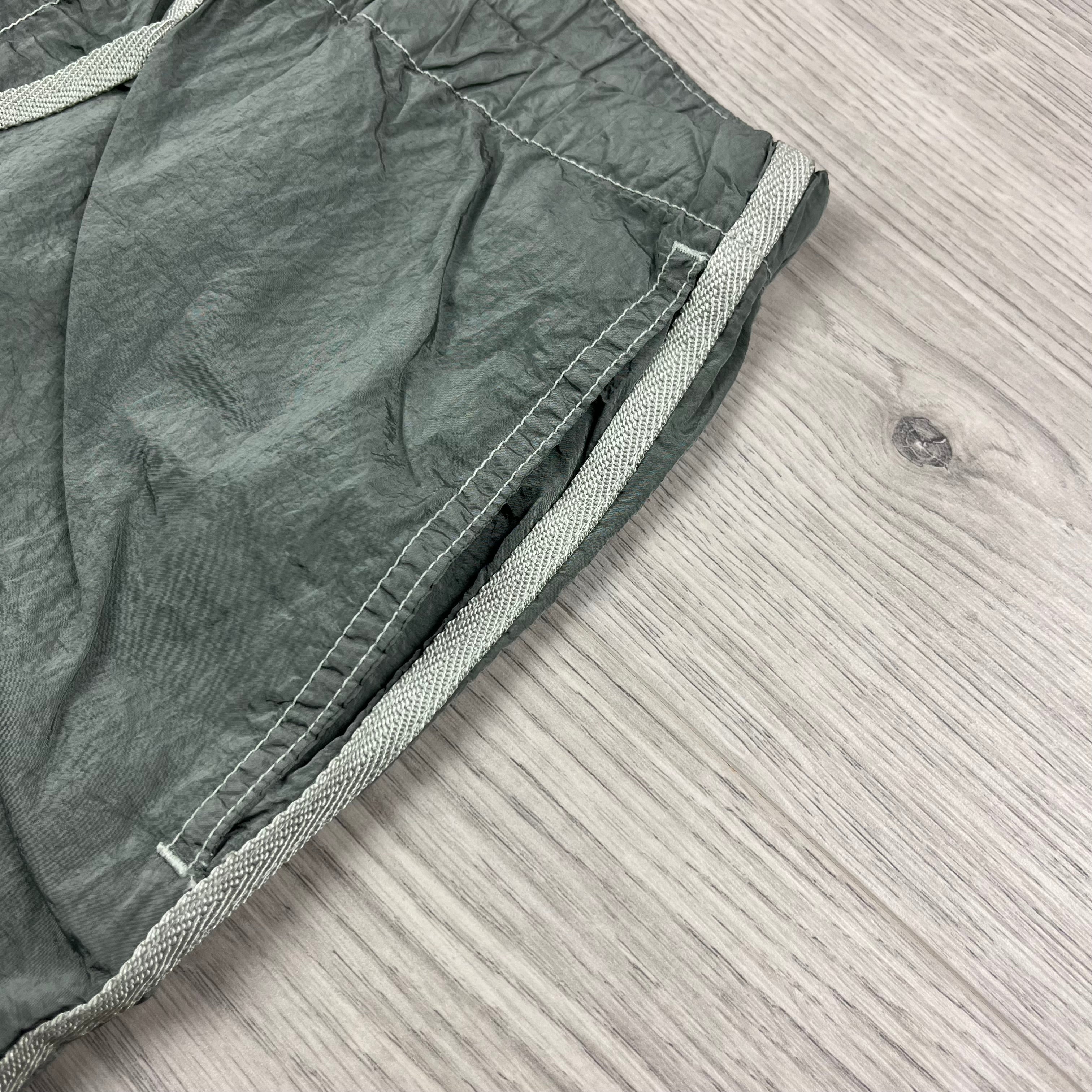 Stone Island Nylon Metal Swim Shorts in Sage Green. On sale at Open Attire.