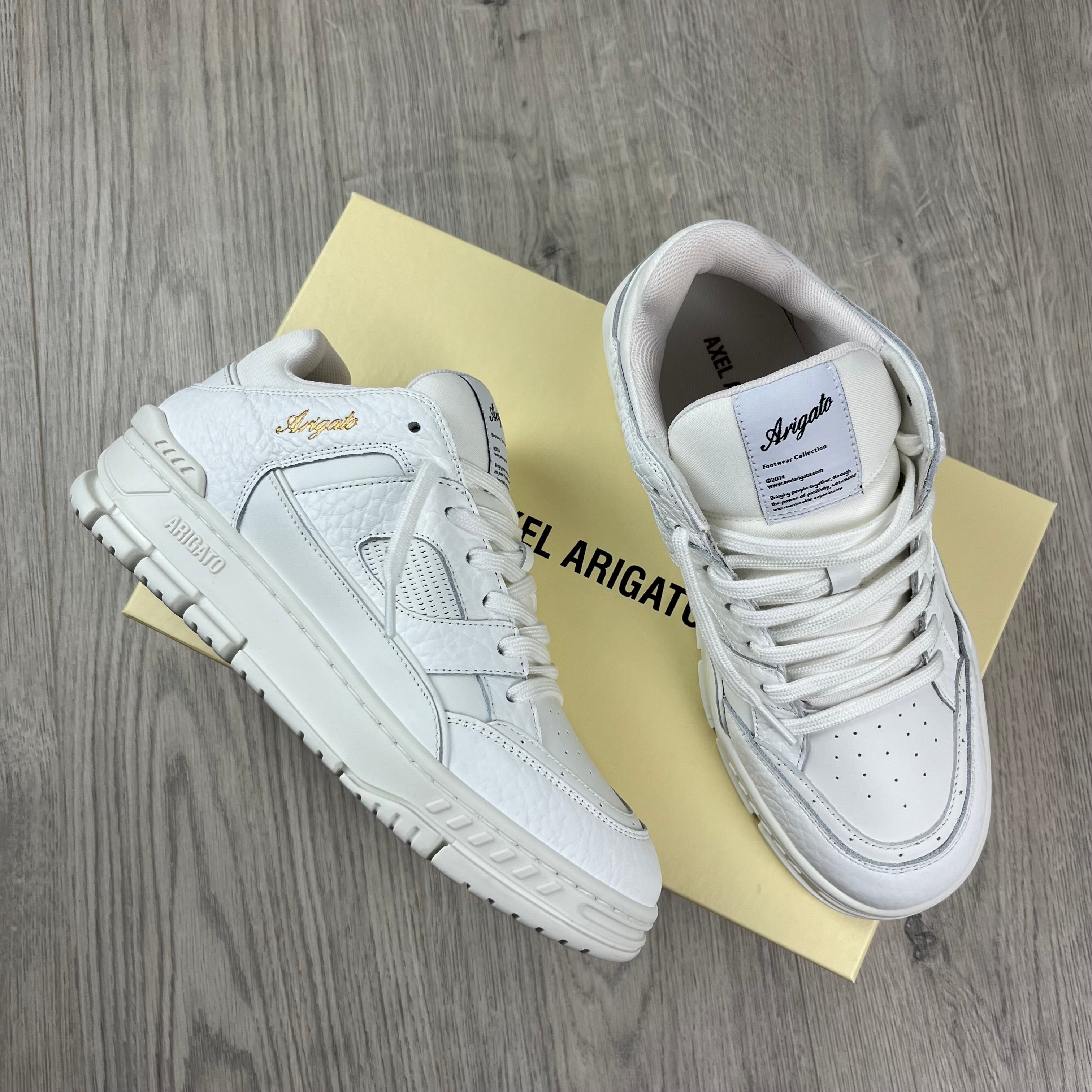 Men's Axel Arigato Arena Lo Sneakers in White. On sale at Open Attire.