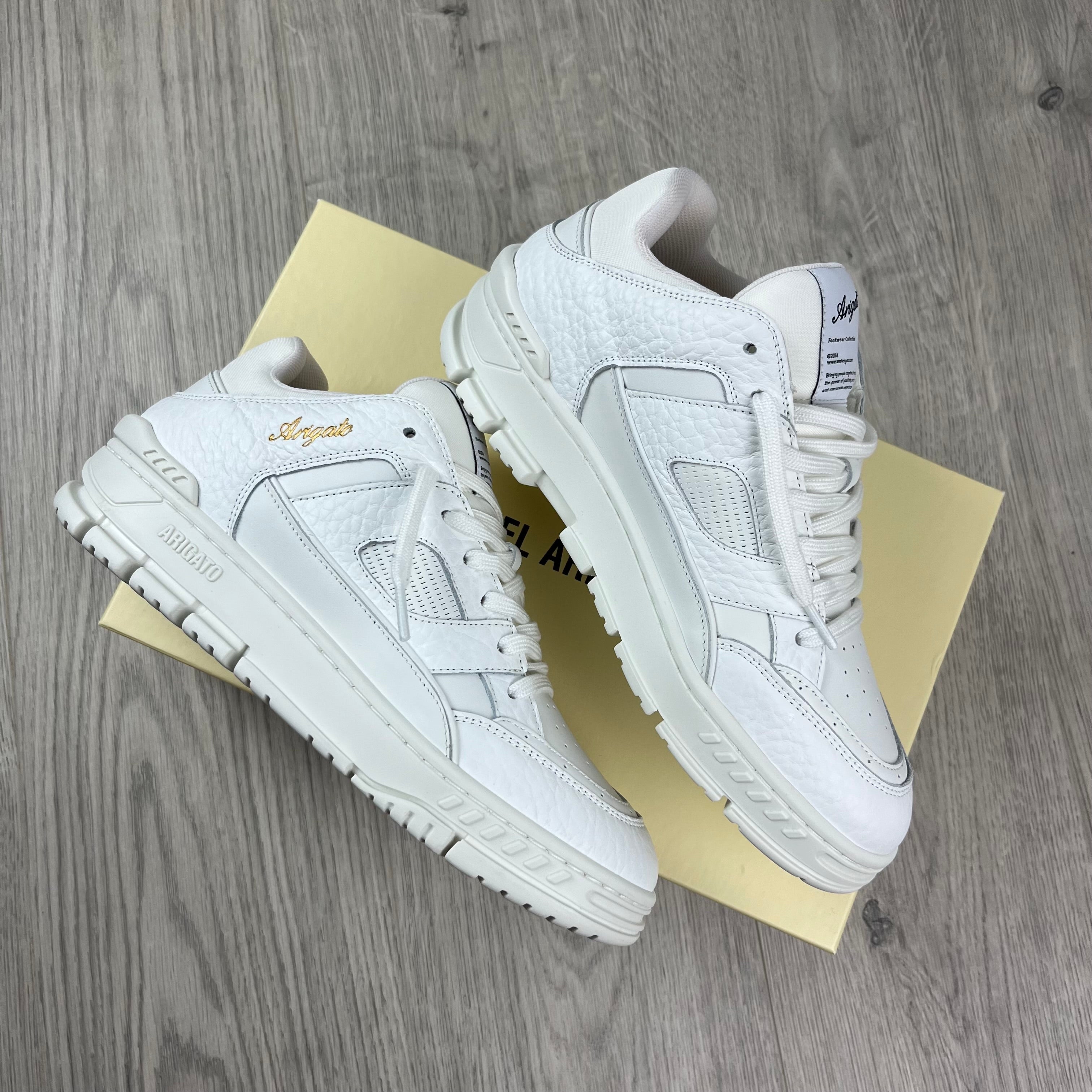 Men's Axel Arigato Arena Lo Sneakers in White. On sale at Open Attire.