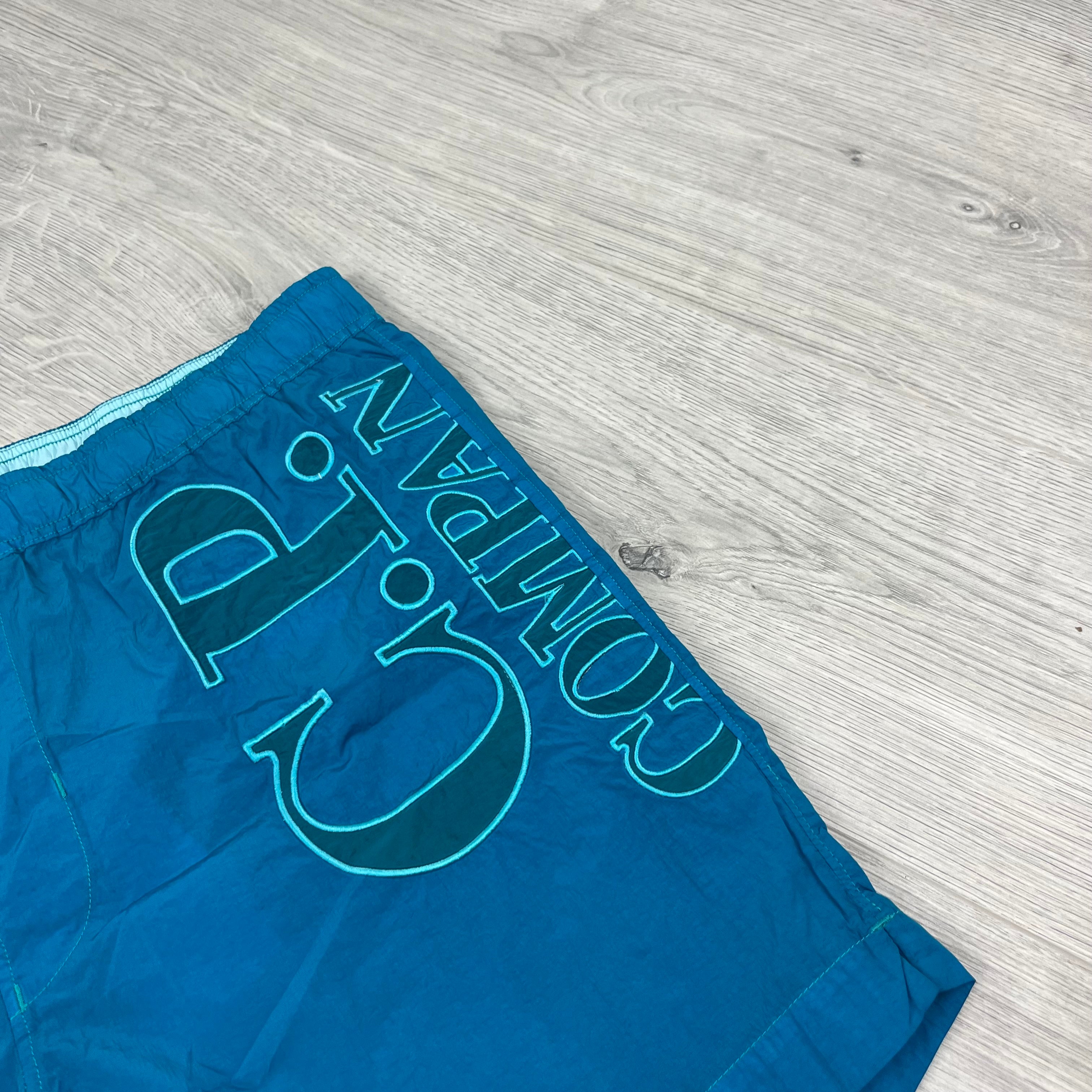CP Company Chrome-R Swim Shorts in Tile Blue. On sale at Open Attire.