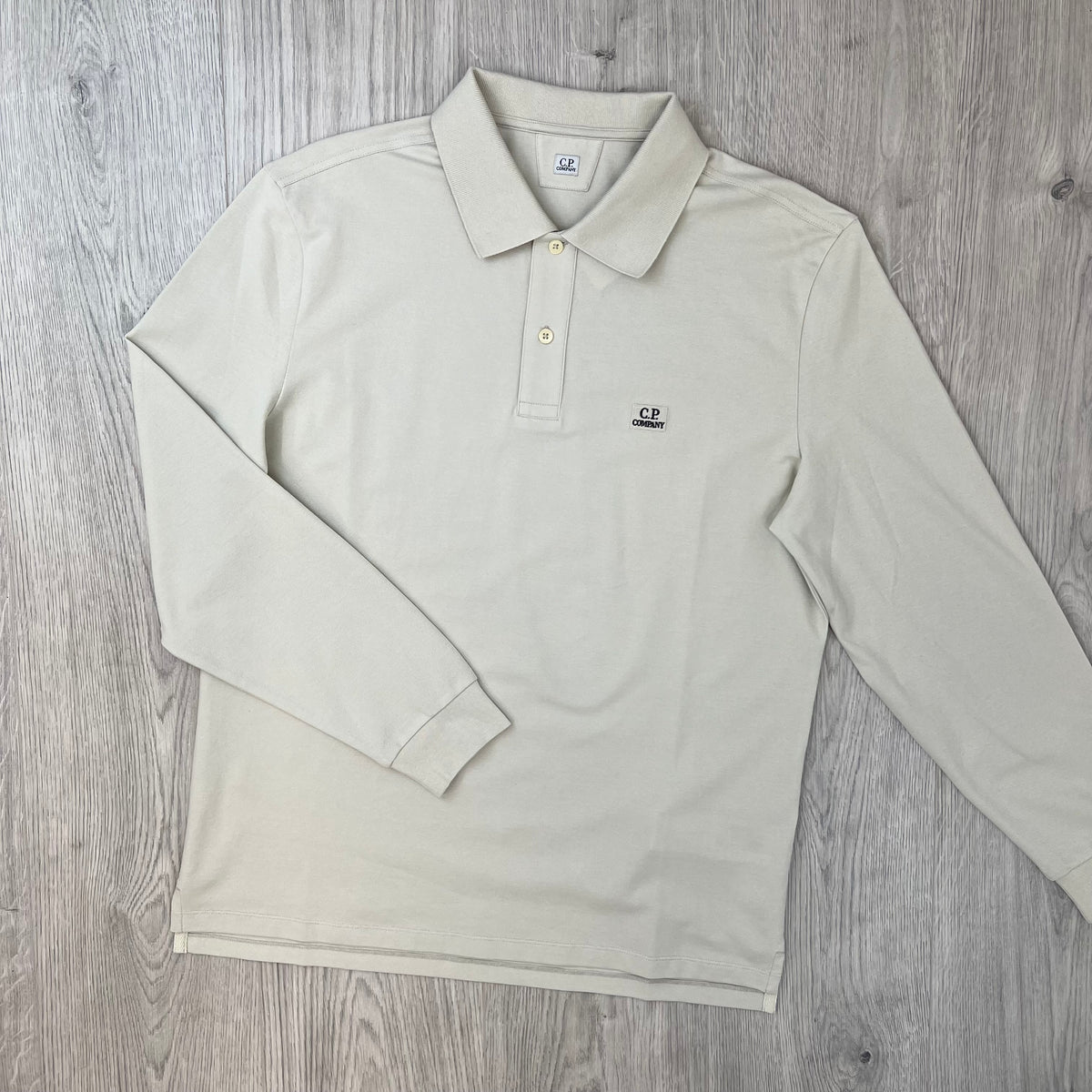Front view of the CP Company Long Sleeve Stretch Piquet Polo Shirt in Silver Birch.