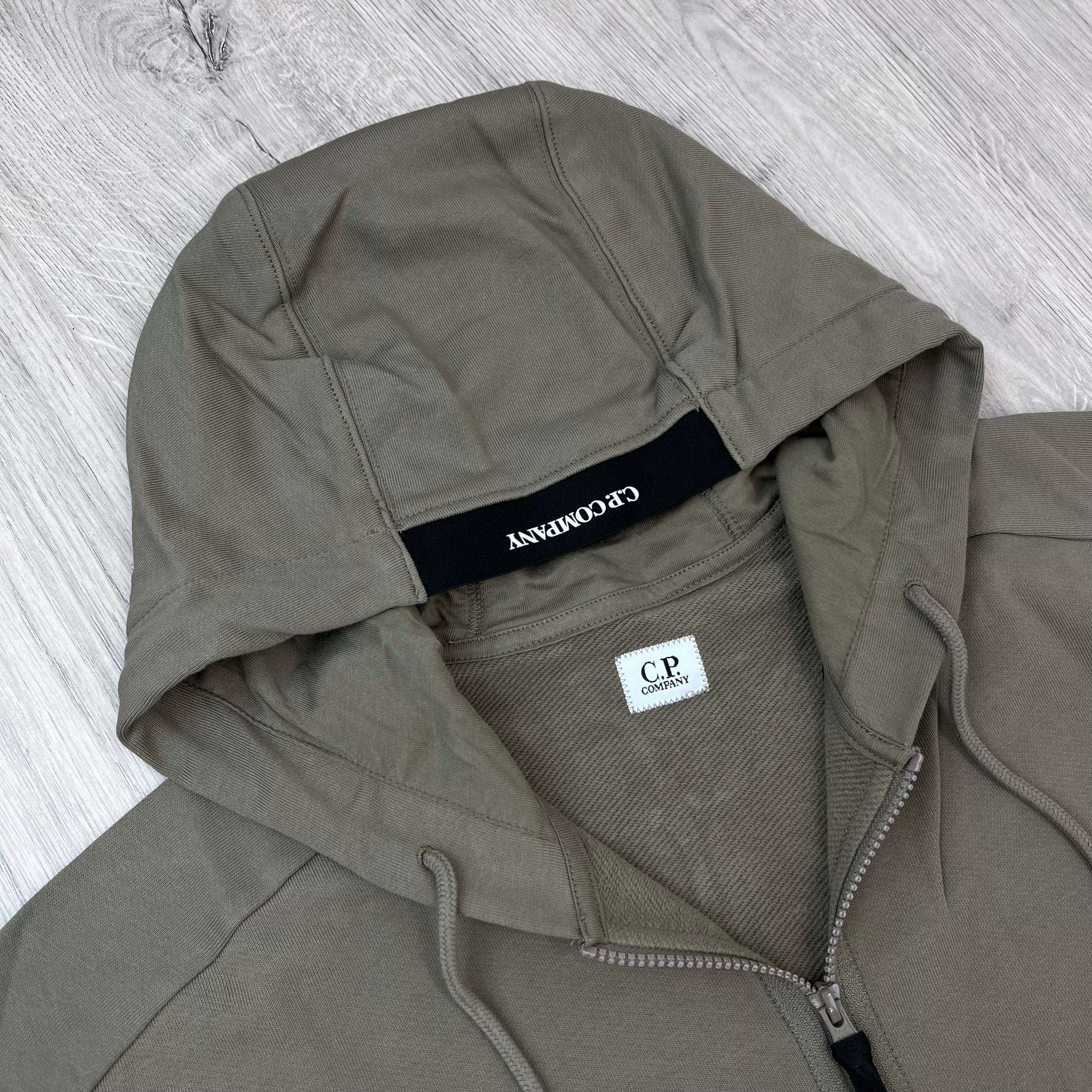 A close up view of the hood on a CP Company Raised Fleece Zip Hoodie in Fallen Rock.