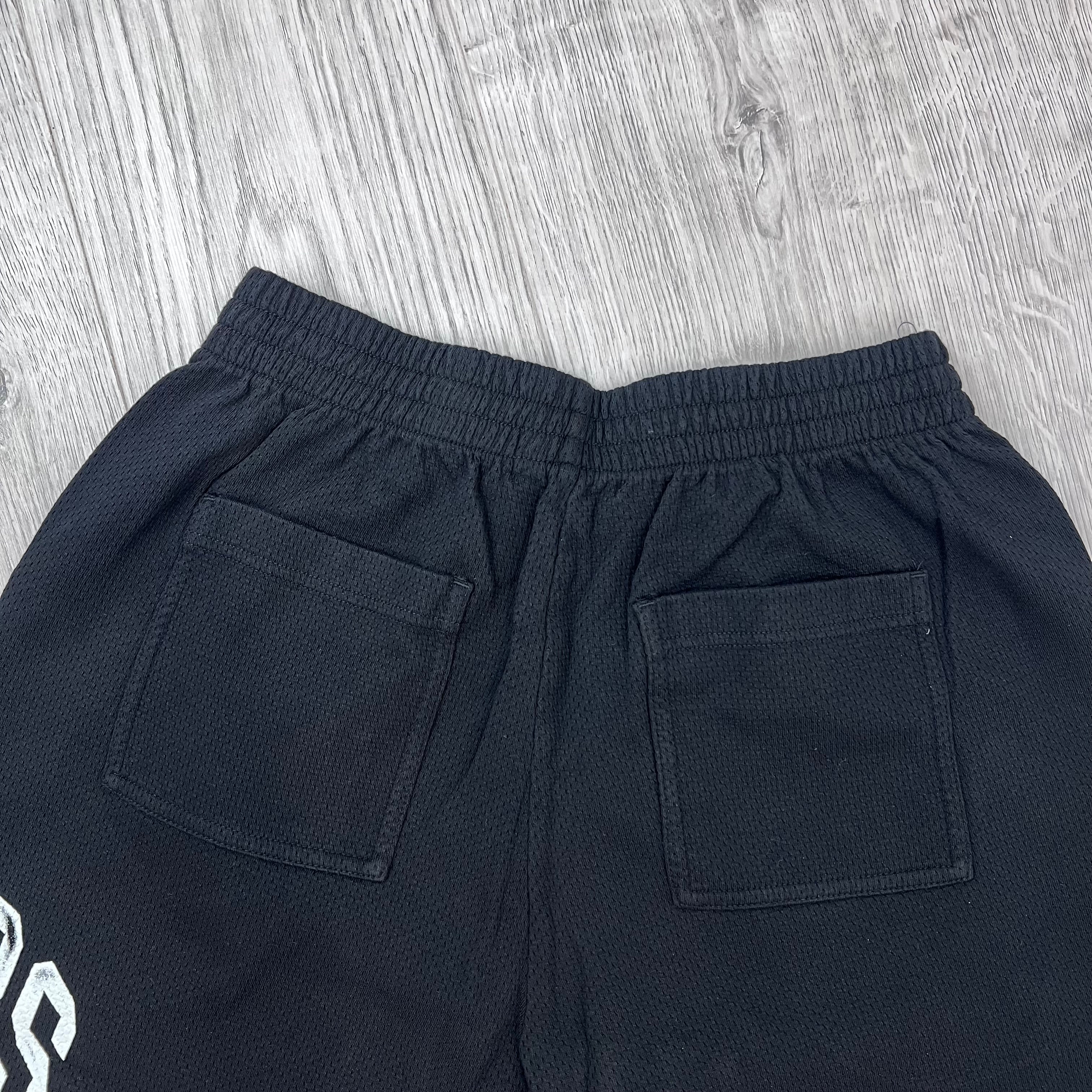 A rear view of Represent Owners Club Mesh Shorts in Black showing the pockets.