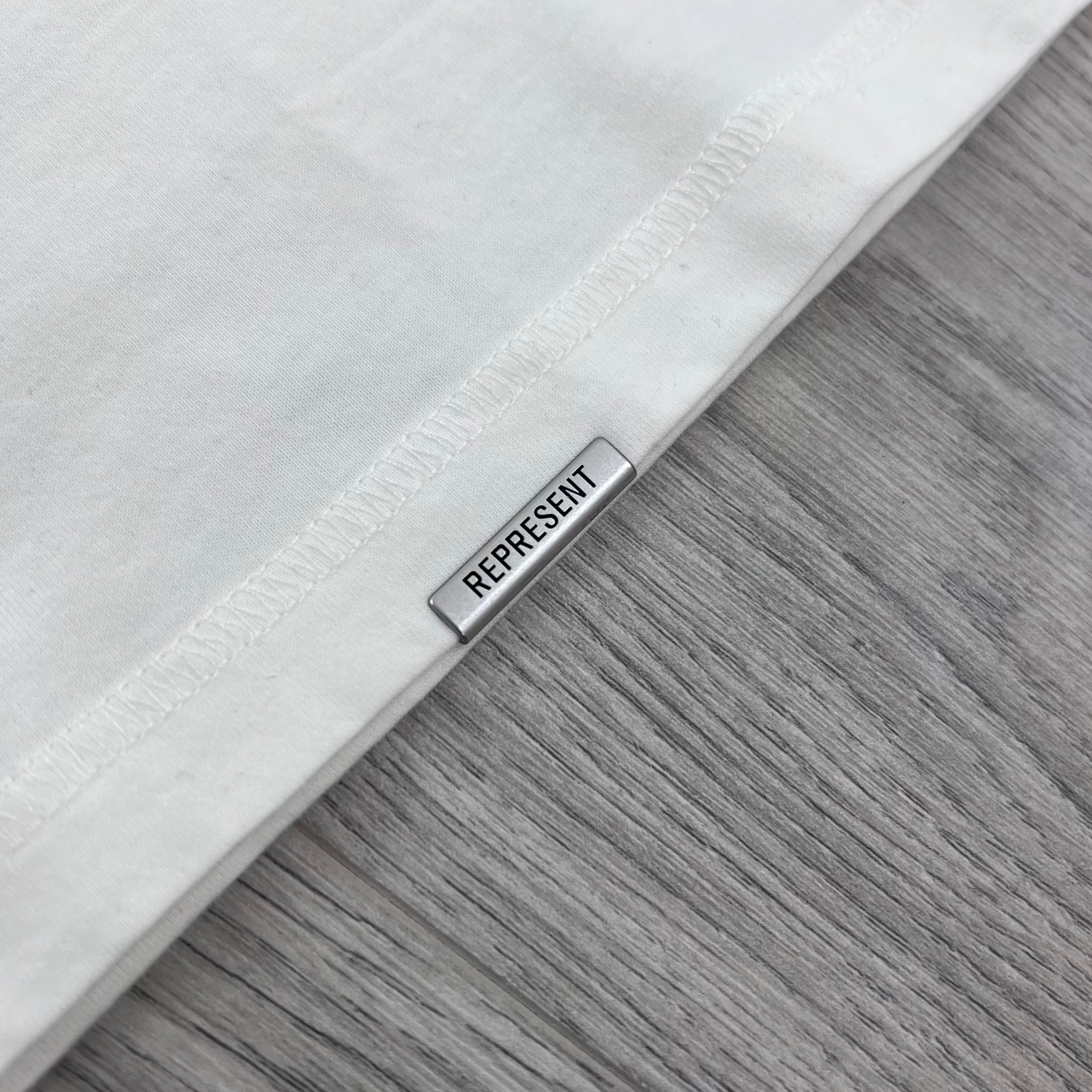 Represent 'Western Initials' T-Shirt in Flat White - Metal hardware detail.